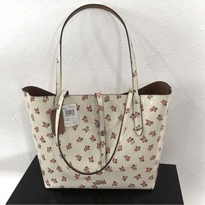 NEW - Coach market tote. Never used. Chalk with rose colored flowers